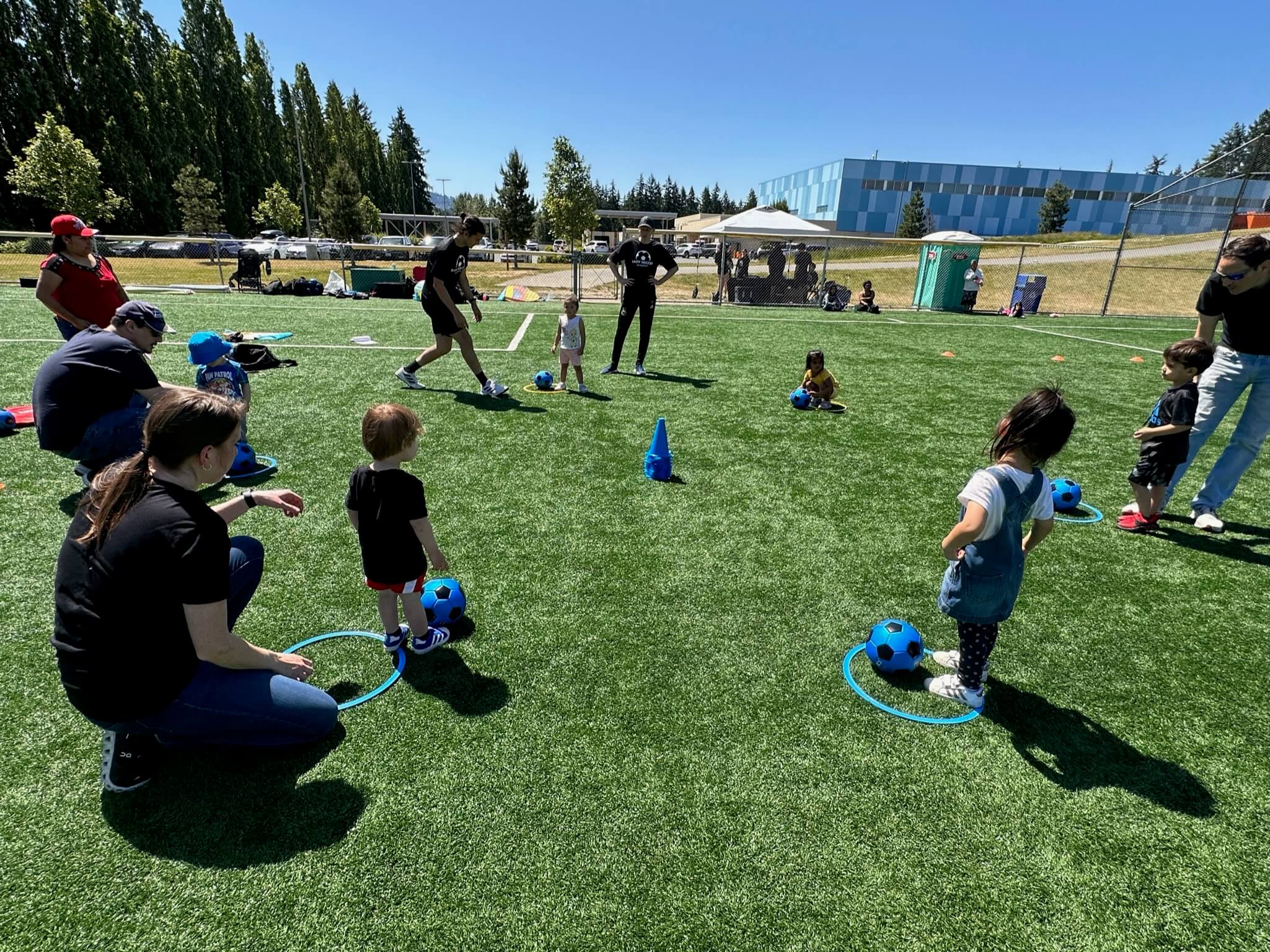 Toddler kicking over a stack of cones